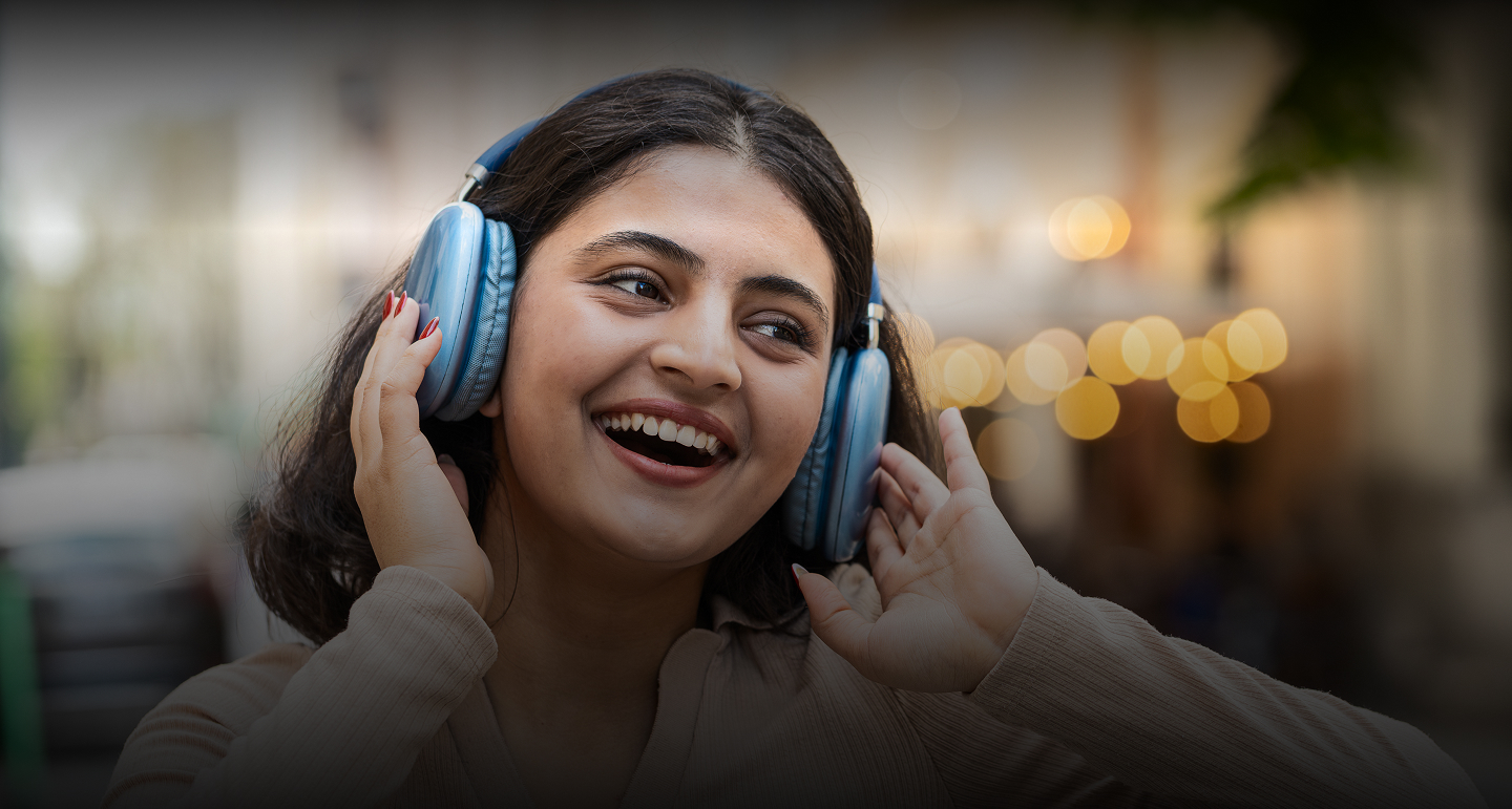 Woman wearing headphones — CarrotKart case study banner